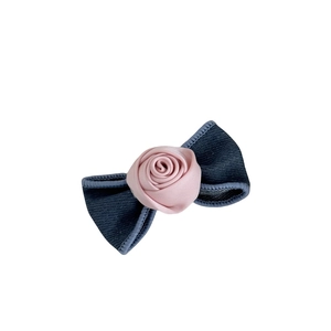 Blue denim bow hair clip featuring a pink satin rose center for women hairstyles