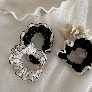 Detail of polka dot scrunchie set with scalloped edges and decorative round beads