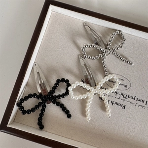 Bow beaded hair clips set with pearls and black beads on silver BB clips in vintage style
