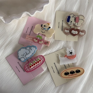 Set of cute cartoon puppy hair clips in various pastel colors and dog designs