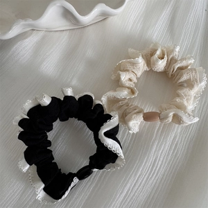 Elegant polka dot hair scrunchies with white lace edges in beige and black colors