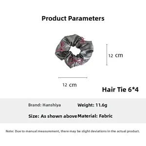 Detailed parameter diagram of silver scrunchie with pink bow details and 12cm diameter