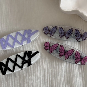 Set of four sweet butterfly bow oval hair clips in pink, purple, and marble patterns