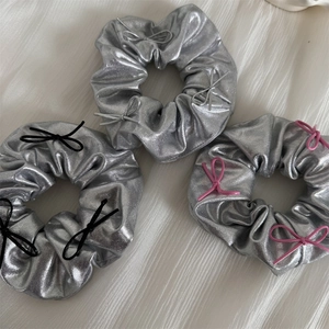 Three-piece Y2K silver metallic scrunchies set with decorative bows in pink and black