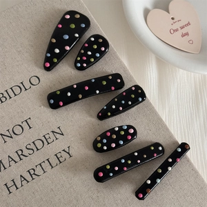 7-piece black hair clip set with colorful polka dots in assorted shapes for women