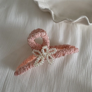 Close-up of pink lace hair claw clip with delicate pearl flower detail for women