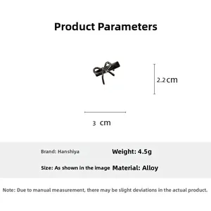 Détails de la pince à cheveux noeud noir fusil, dimensions 3cm x 2,2cm et poids 4,5g