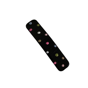 Cute black hair clip with colorful rainbow polka dots in a minimalist matte finish