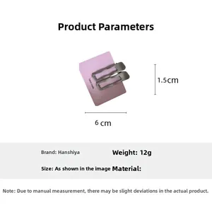 Détail de barrettes argentées sur carte mauve, longueur 6 cm et poids 12 g indiqués