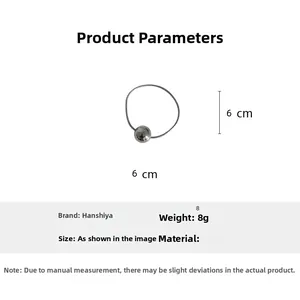 Technical view showing a 6cm diameter silver elastic hair tie with a 8g metallic ball