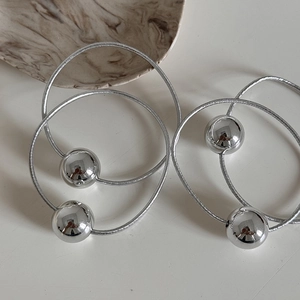 Close-up of shiny silver metallic bead elastic hair ties with high-stretch cord