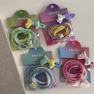 Detailed set of colorful hair ties and clips in green, purple, blue and pink macaron colors