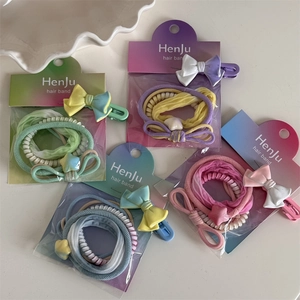 Colorful macaron hair accessories set with elastic bands and a sweet bow clip
