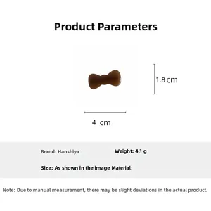 Detail view of a brown acetate bow hair clip with size dimensions of 4cm by 1.8cm