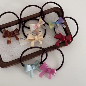Set of 7 high-elasticity hair ties with acrylic bowknot charms in various marble colors