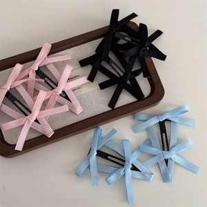 Set di fermagli per capelli con fiocchi di nastro colorati in rosa nero e blu