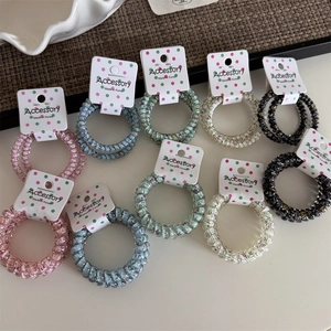 Set of colorful polka dot telephone wire hair coils in pastel floral and stripe patterns