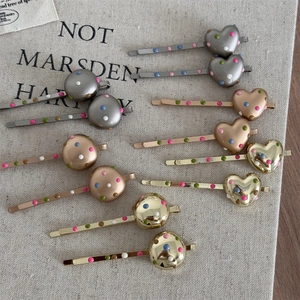 Minimalist metal hair clips set with colorful drip glaze dots and heart shapes