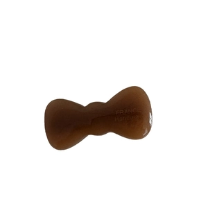 Brown acetate bow hair clip with France Handmade engraving on a white background