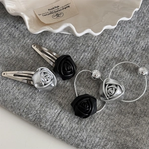 Minimalist leather rose hair clips and metallic rings set in black and silver