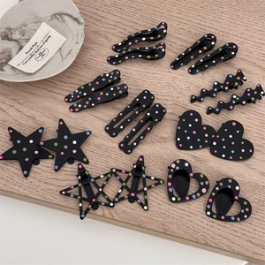 Set of black matte metal hair clips with colorful polka dots in various geometric shapes