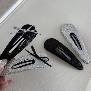 Sparkly silver and black snap hair clips with glitter finish and ribbon bows 4-pack