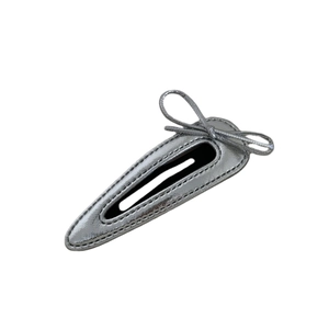 Silver leather teardrop hair clip with a minimalist bow design for children