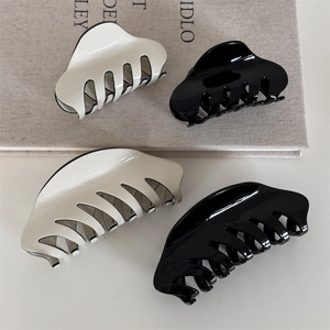 Minimalist French hair claw clip set in glossy black and cream white finish