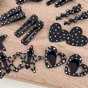 Set of black matte hair clips with colorful polka dots in heart and star shapes