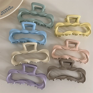 Set of wavy pastel alloy hair claws in mint green, light blue, and lilac colors