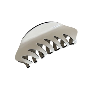 Classic French hair claw clip in beige and black acrylic with a high-gloss mirror finish