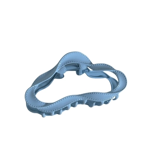 Morandi light blue alloy hair claw clip with wave design and matte finish on white background