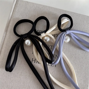 Three-piece satin ribbon hair ties set with large white pearl charms in assorted colors