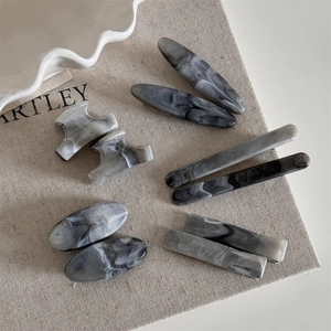 Minimalist marble grey acetate hair claw clips and barrettes set in elegant Nordic style