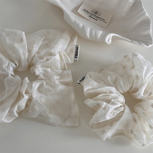 Elegant cream white scrunchie with floral embroidery in a minimalist French style