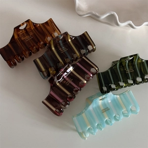 French style striped acetate hair claws in various colors for elegant hairstyles