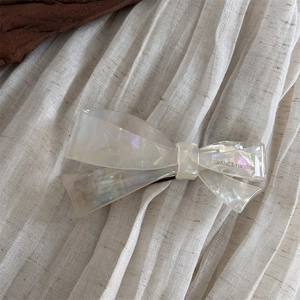 Close-up of acetic acid hair clip with pearl luster and France Handmade engraving