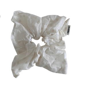 Elegant creamy white scrunchie with daisy embroidery in lightweight fabric for women