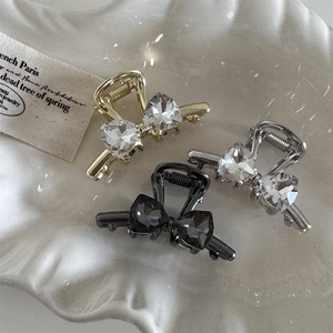 Set of three mini butterfly hair claws with rhinestones in gold, silver and black