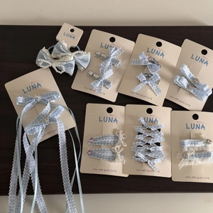 Blue plaid hair clips with rhinestones, lace, and pearls in a sweet aesthetic design