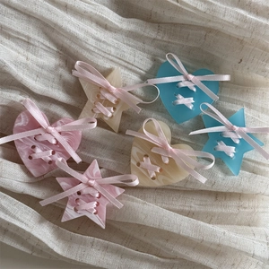 Cream star hair clip with marble acrylic heart and sweet pink ribbon bow accessory