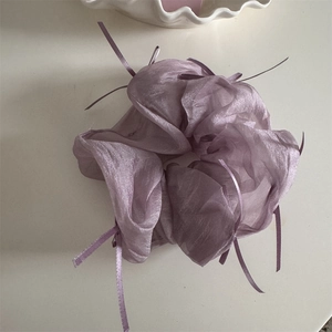 Detail of light purple organza scrunchie with soft ribbon bow in French ballet style
