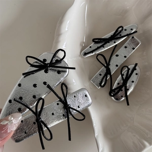 Silver metallic leather hair clips with black polka dots and bows in various shapes