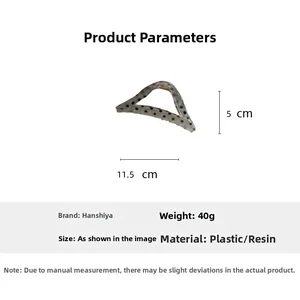 Size chart showing 11.5cm length and 5cm height of the grey polka dot hair claw clip