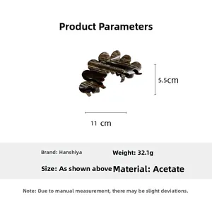 Detail view of large marble brown acetate hair claw clip showing 11cm size and 32g weight