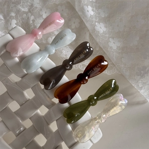 Barrettes nœud en acétate de style français en six couleurs sur panier en céramique