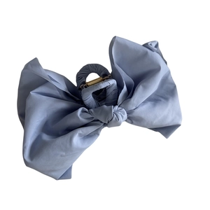 Light blue fabric bow shark hair clip for women with elegant oversized textile design