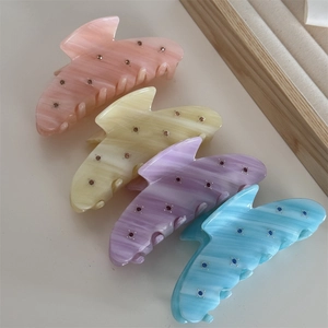 Elegant diagonal patterned acetate hair claws with rhinestones in four soft pastel colors