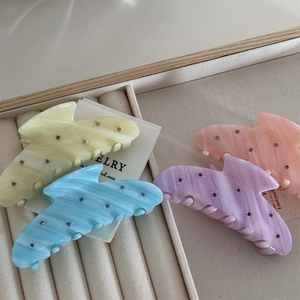 Set of four acetic acid hair claws with colored rhinestones in yellow blue purple and pink