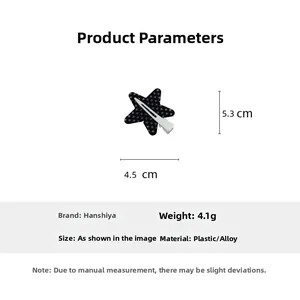 Star hair clip with polka dots and dimensions 4.5 x 5.3 cm weighing 4.1 grams